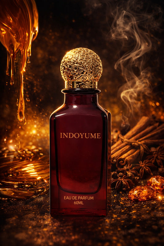 Indoyume perfume bottle with gold cap on a dark background